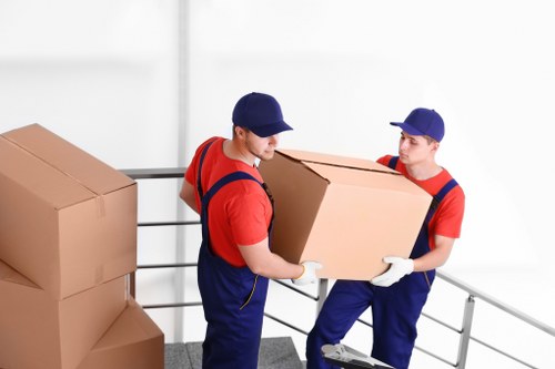 A Whitton house removal loading process with boxes and furniture