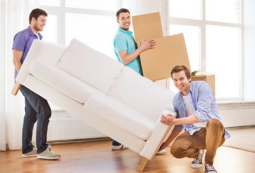 Local movers handling furniture during a Whitton house move