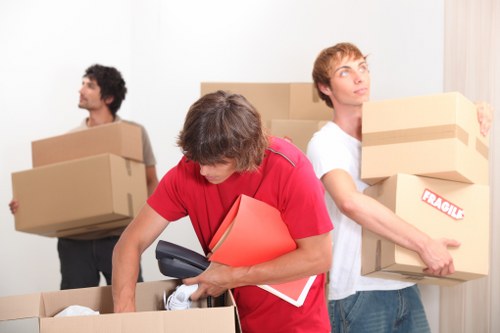 Professional movers handling office equipment during a Whitton business move