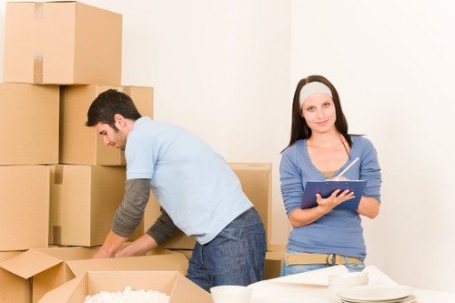 Packed office boxes and labelled items ready for transport