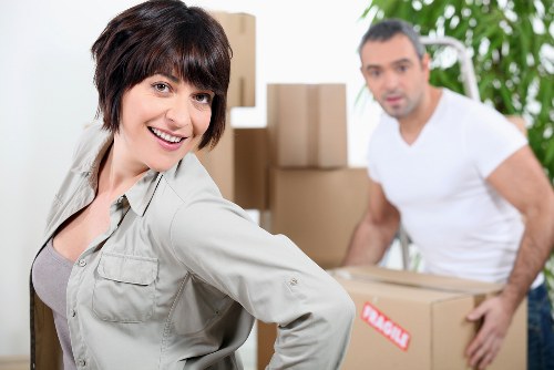 Packed moving boxes and furniture ready for transport in Whitton